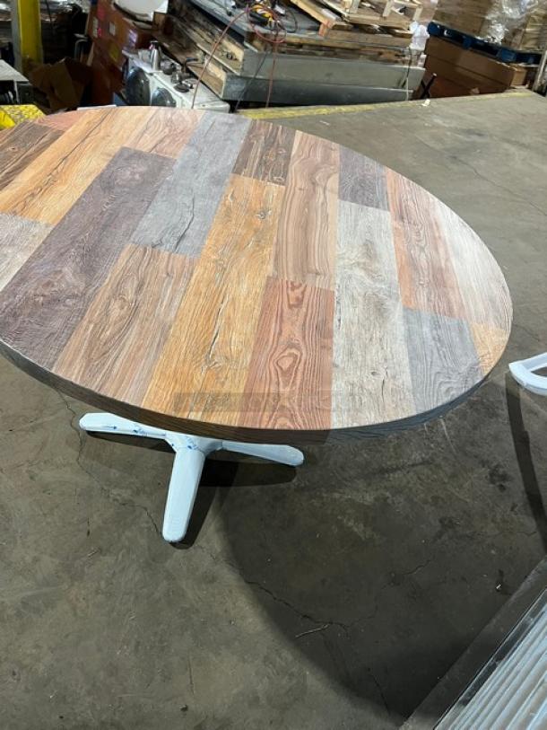 Brand new Barn Wood Plank rustic dining table with 4-way pedestal base, round top, durable, commercial-grade condition.