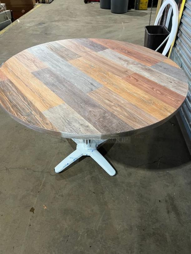 Barn wood plank round dining table with 4-way pedestal base. Rustic DuroWood design. New condition, commercial grade.