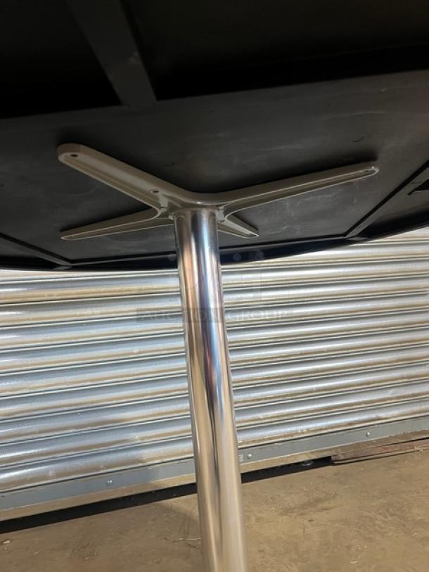 Brand new barn wood plank DuroWood dining table with 4-way pedestal base, featuring a rustic commercial design.