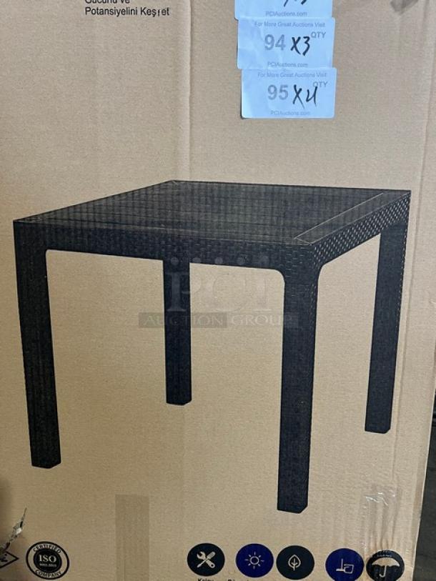 Brand new 80"x80" brown polypropylene square outdoor table, faux wood slats, rattan finish, on legs, in box.