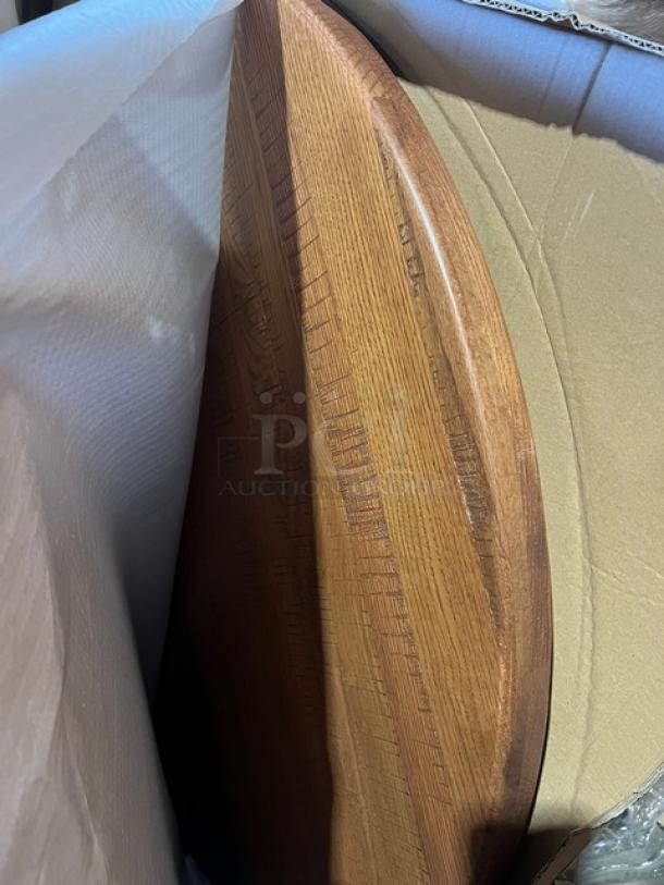 Brand new commercial 42" round dining table in red oak. Textured surface, regular height base. High-quality craftsmanship.