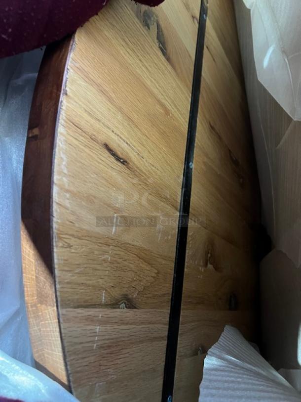 Brand new commercial red oak 36" round textured dining table. Visible wood grain and sturdy construction. Regular height base included.