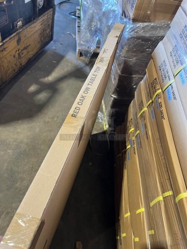 Brand new commercial red oak 36" round dining table, textured finish, with regular height base, in packaging.