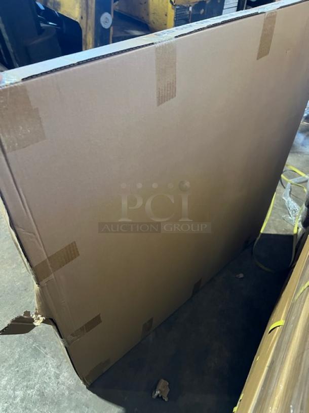 Brand new 36" round textured red oak dining table in packaging, regular height base included.