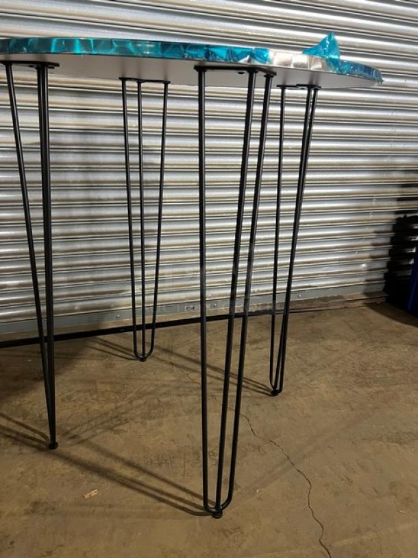 Brand new round aluminum cocktail table, model TAD36, with matte steel hairpin legs. Suitable for indoor/outdoor use.