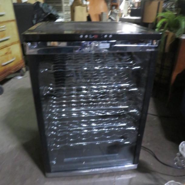 Avanti glass door cooler, Model WC600CL/WC601CL, with 6 racks. Measures 23.5x22.5x34 inches, 115 Volt, in working condition.