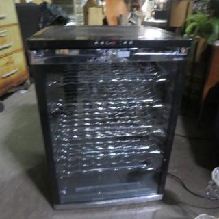 Avanti glass door cooler, Model WC600CL/WC601CL, with 6 racks. Measures 23.5x22.5x34 inches, 115 Volt, in working condition.