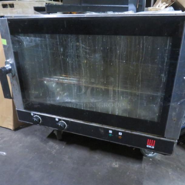 Tecnoeka EKFA464AL 32" electric convection oven, 240V, with 1 rack. Model# visible. Used condition. Working when removed.