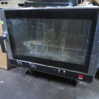 Tecnoeka EKFA464AL 32" electric convection oven, 240V, with 1 rack. Model# visible. Used condition. Working when removed.