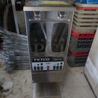 Fetco GR2.3 dual hopper coffee grinder, new, portion-controlled, 120V, includes manual, measures 9x16x28.5 inches.