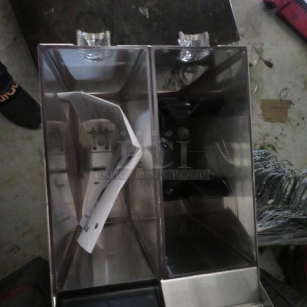 Fetco GR2.3 dual hopper coffee grinder, new condition, includes manual, portion controlled, 120V, dimensions 9x16x28.5 inches.