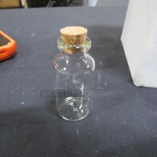 Set of 36 new wedding party favor glass bottles with cork lids, clear glass, ideal for storing small items or decoration.