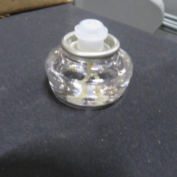 Opened case of Hollowick HD12-72 12-hour disposable liquid votives, clear glass, new condition.