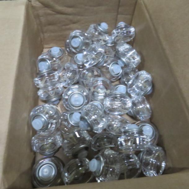 Opened case of Hollowick HD12-72 12-hour disposable liquid votives, clear plastic, new condition.