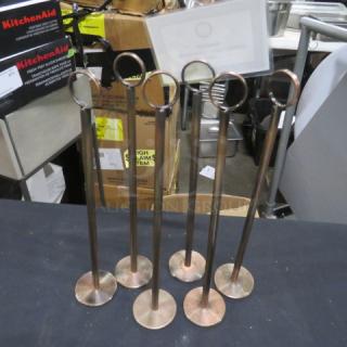 Set of six metal table markers with circular holders, in good condition, ideal for restaurants or events.