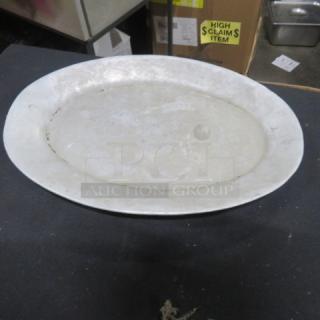 11.5x8 inch aluminum platter, silver-toned, lightly worn, oval shape. Suitable for serving or display.