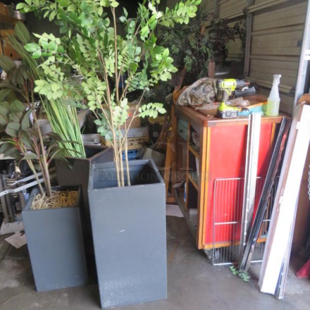 Black planter with tree, dimensions 17x17x32.5 inches. Modern design, excellent condition, vibrant green foliage.