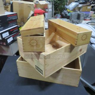 Lot of assorted wooden boxes with sun emblem, featuring dovetail joints. Good condition. Various sizes, suitable for storage.