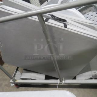 Metal table moving cart, sturdy frame, no tables included, visible wheels for easy transport, used condition.