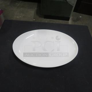 Fortessa platter, 13.5x9.5 inches, oval shape, pristine white, excellent condition, ideal for serving.
