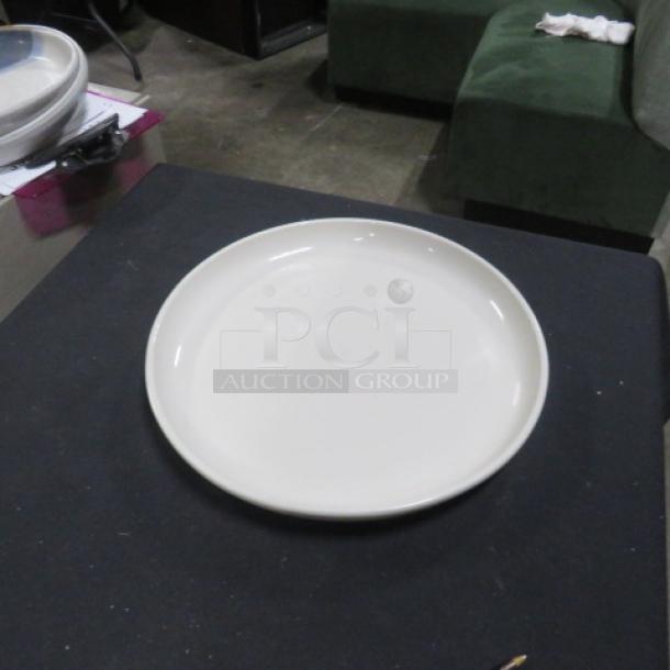 13-inch round iti plate, white, good condition, no visible markings or damage, displayed on a dark surface.