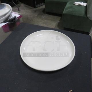 13-inch round iti plate, white, good condition, no visible markings or damage, displayed on a dark surface.