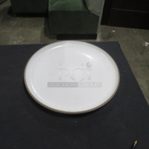 13.5-inch round white plate with subtle edge detailing, visible light wear, and a smooth finish.