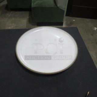 13.5-inch round white plate with subtle edge detailing, visible light wear, and a smooth finish.