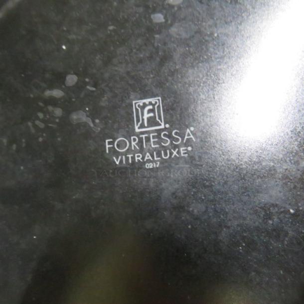 Fortessa black dinner plate, 11 inches, Vitraluxe model. Visible logo reads "FORTESSA VITRALUXE 0217". Good condition.