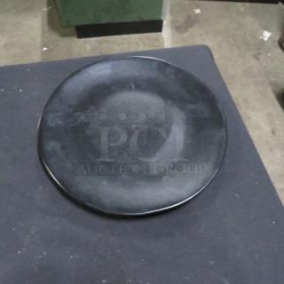 11-inch Fortessa black dinner plate in good condition, model 12XBID. Simple design, ideal for dining collections.