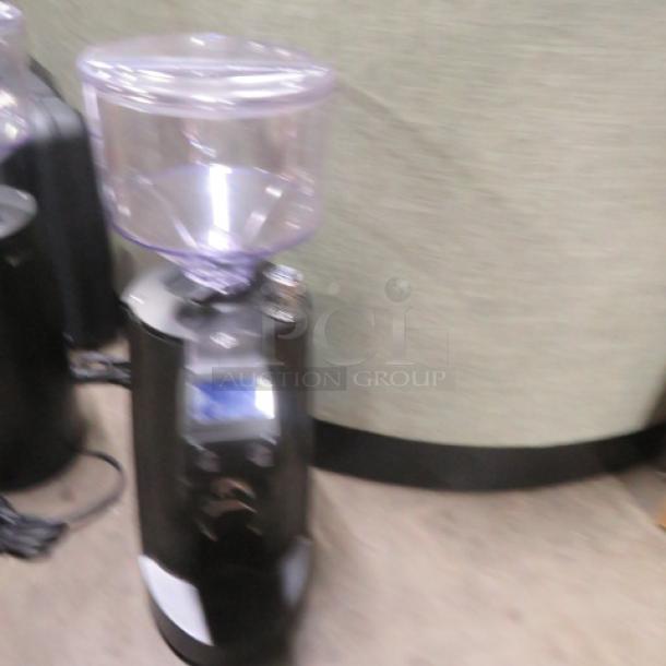 New Nuovo Simonelli MDJ On Demand black espresso grinder, 3.53lb capacity, digital display, 110V, excellent condition.