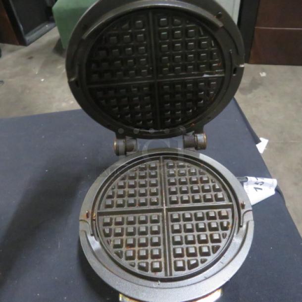 All Clad stainless steel waffler, model 6071. 800W, 120V. Features round waffle plates, lightly used.