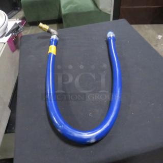 Blue gas line, new condition, with brass connector and visible label.