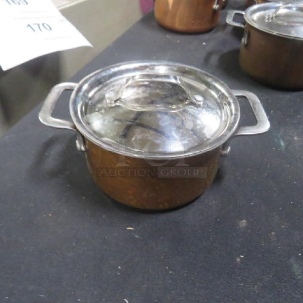 Williams Sonoma 4.5" copper mini cocotte with lid, featuring dual handles. Condition appears used. Price: $189.95.