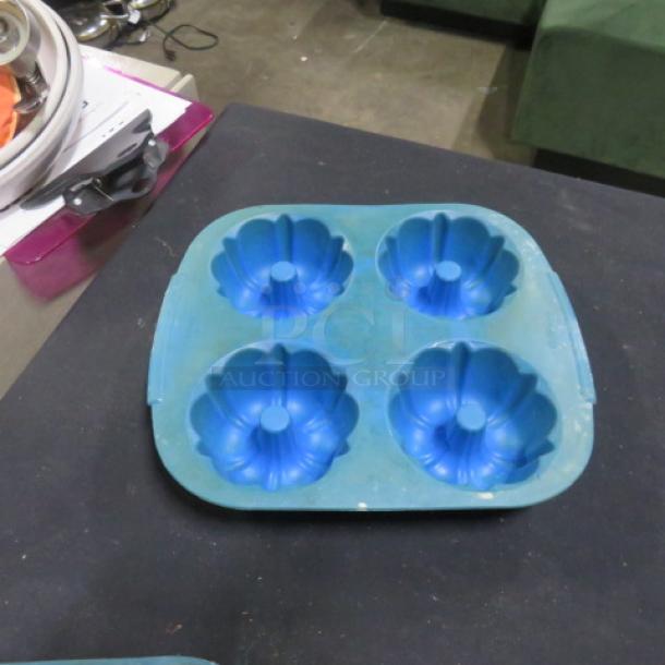 Wilton Silicone Mini Bundt Cake Mold, 4-cavity, blue, gently used, flexible, non-stick, 4XBID model.