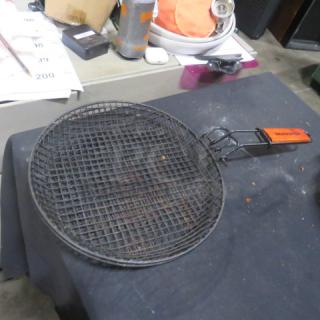 Round BBQ Master fry basket with non-stick mesh, wooden handle, and visible branding. Used condition.