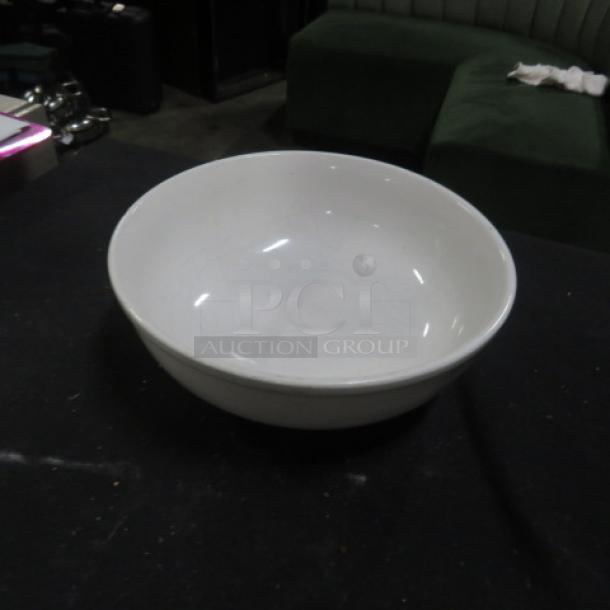 8-inch ITI white bowl, model 11XBID, in good condition, with a simple, smooth design on black background.