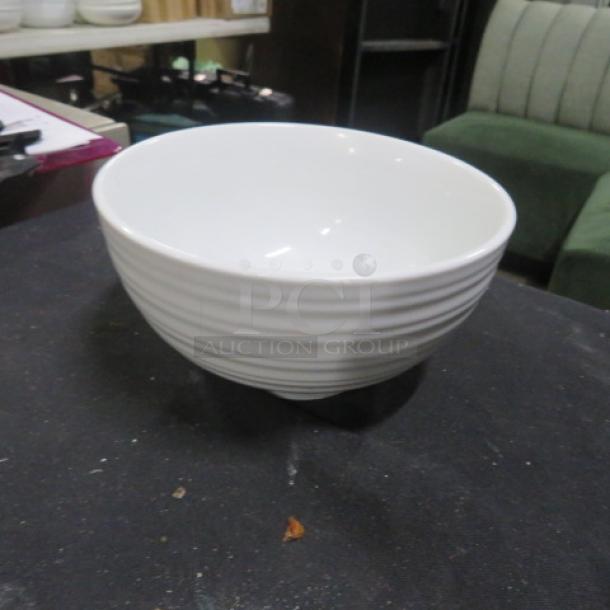 6.5-inch white ceramic bowl with subtle horizontal ridges, in excellent condition.
