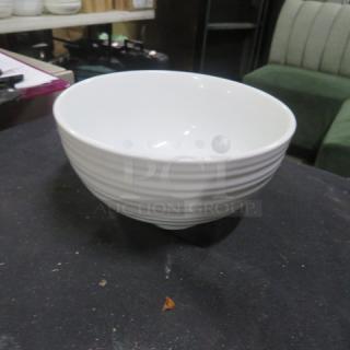 6.5-inch white ceramic bowl with subtle horizontal ridges, in excellent condition.