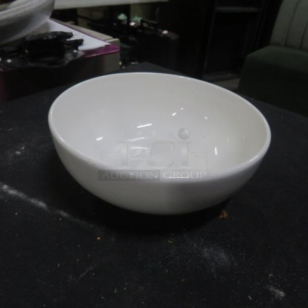 White 6-inch bowl in good condition, smooth finish, with no visible markings or labels, item number 14XBID.