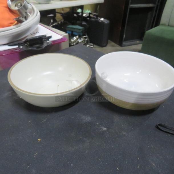Two assorted 6.5-inch bowls, white with subtle rim design, used condition. Ideal for serving; versatile tableware set.