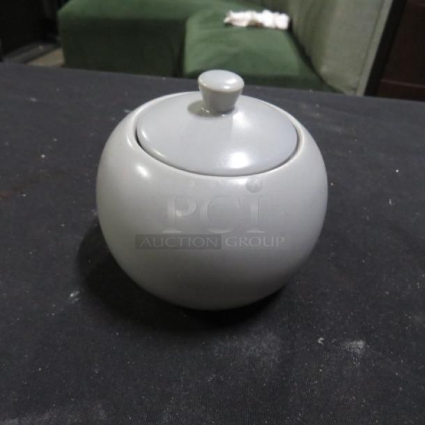 Gray Fortessa sugar bowl with lid, round shape, excellent condition, smooth finish, sturdy ceramic material.
