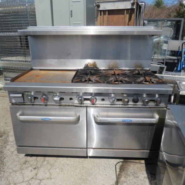 Cook Rite natural gas range with 6 burners, 24" griddle, double ovens, 3 racks. Stainless steel over shelf. Dimensions 60x32x57.