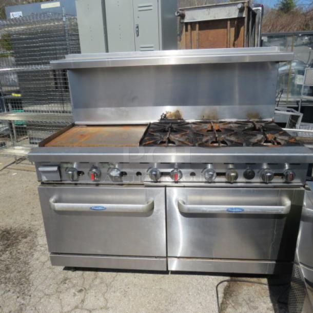 Cook Rite 6-burner natural gas range with 24" griddle, double ovens, 3 racks, stainless steel overshelf, on casters. 60x32x57 inches.