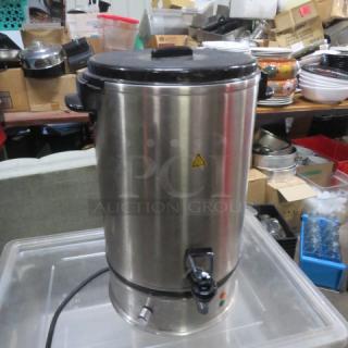 Stainless steel water boiler, Model ND120-18L, 120 Volt, in good condition with visible spout and control knob.