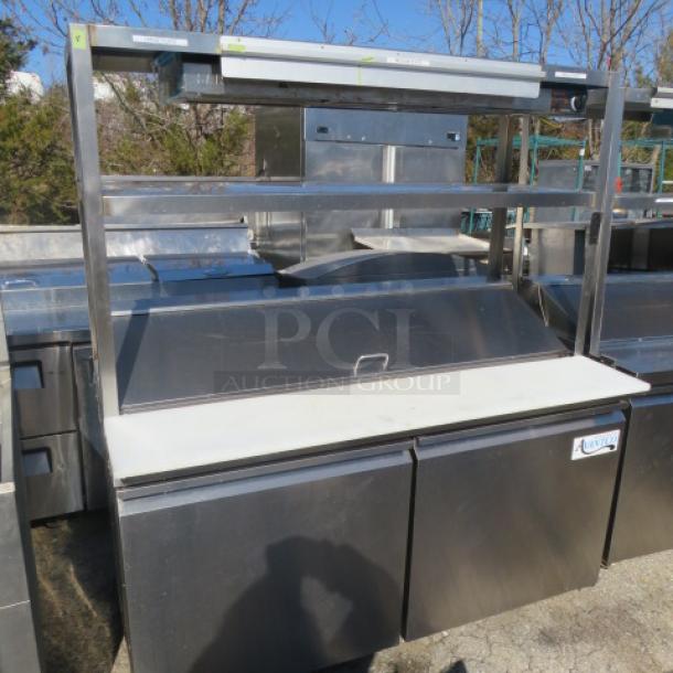 Avantco 2-door refrigerated prep table with cutting board, stainless overshelves, ticket rail, and Servit food warmer, on casters. Model 178SSPT60-HC.