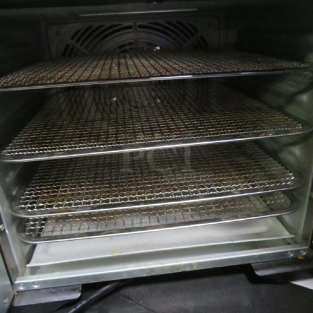 Septree DSC-08A food dehydrator with 4 racks. 800 Watt, 120 Volt. Dimensions: 14x17.5x13.5 inches. Good condition.