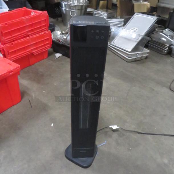 Pelonis PTC fan heater, model PHT30D7BBB, 120 Volt, black, standing vertical. Appears in good condition.