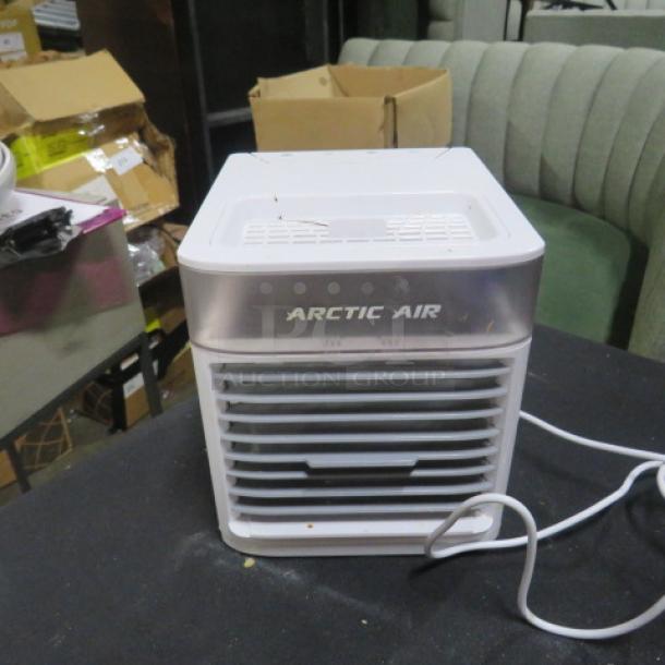 Arctic Air 2.0 Pure Chill, 120 Volt mini air cooler, front view showing vent and logo. Appears in used condition.