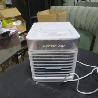 Arctic Air 2.0 Pure Chill, 120 Volt portable cooler, white and silver, in good condition, with visible branding.